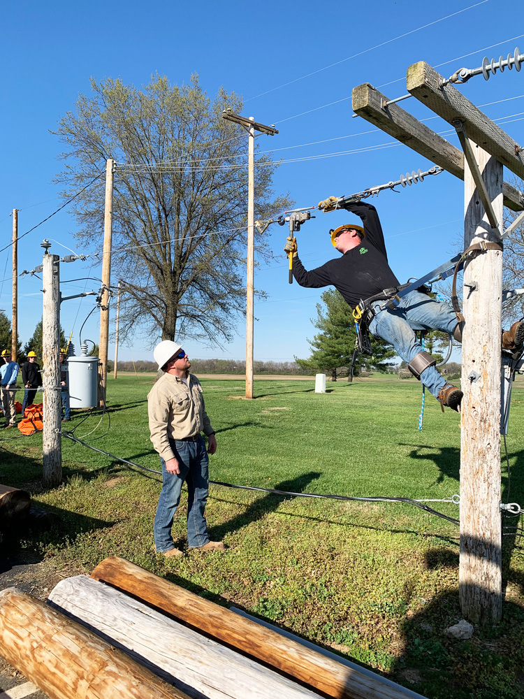 Ben Jones (left), works with student Caden Shoemaker of Leesburg on a practice pole during class. Caden said he heard about Pickaway-Ross’ Power Line program from friends and, like his instructor, wanted a job that will let him work outside and provide job security.