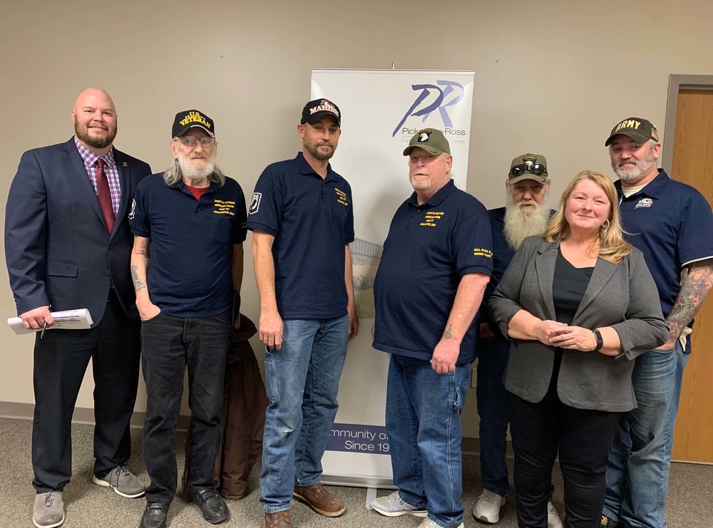 Members of American Legion Post 757 pose with Jason Vesey (left), and Susan Schwalbauch after presenting the donation at the Pickaway-Ross Board of Education meeting in December. 