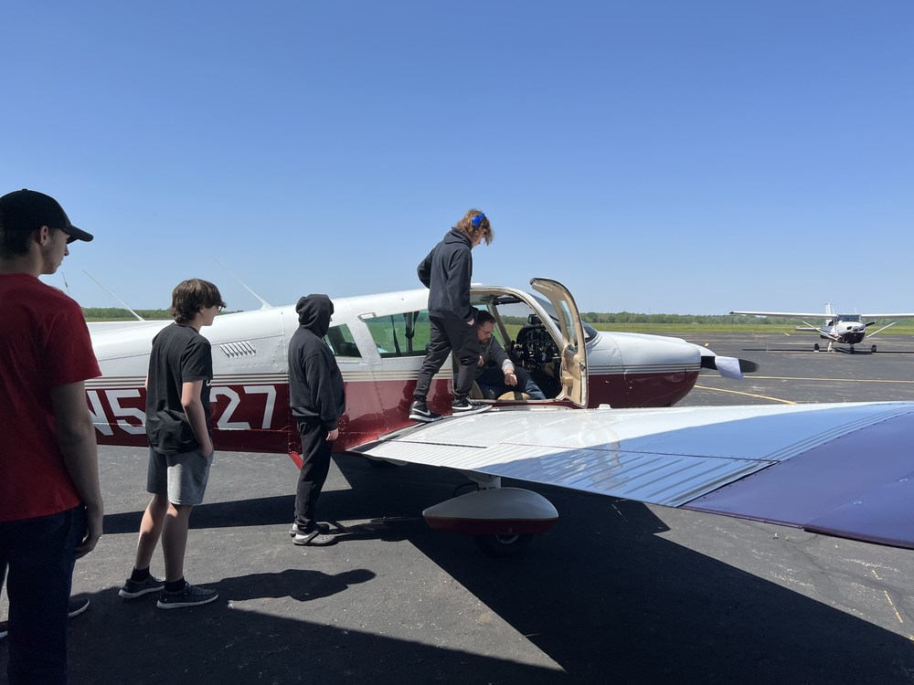 Students take turns sitting in a plane at the Pickaway County Airport.