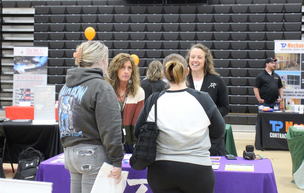 Amy Poorman (left) and Britany Greenwalt staff a table at College & Career Night.